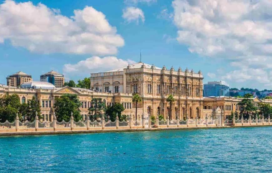 Dolmabahce Palace viewed from a boat cruise on the Bosphorus in Istanbul, Turkey.