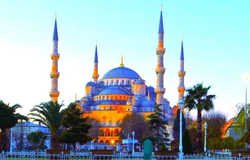 Exterior view of the Blue Mosque (Sultan Ahmed Mosque) in Istanbul, Turkey, showcasing its iconic domes and minarets.