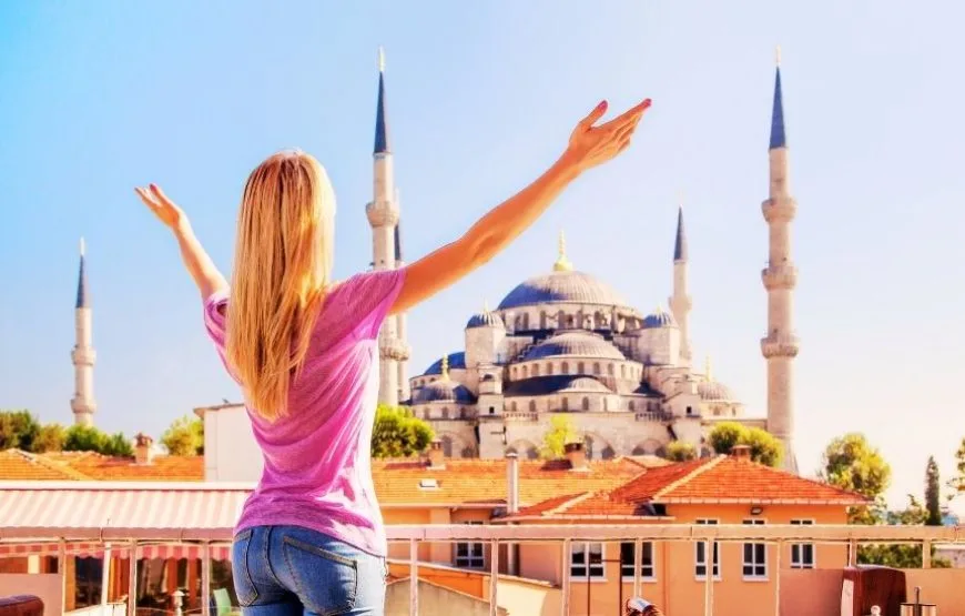 The Blue Mosque in Istanbul with its stunning domes and minarets under a clear sky.