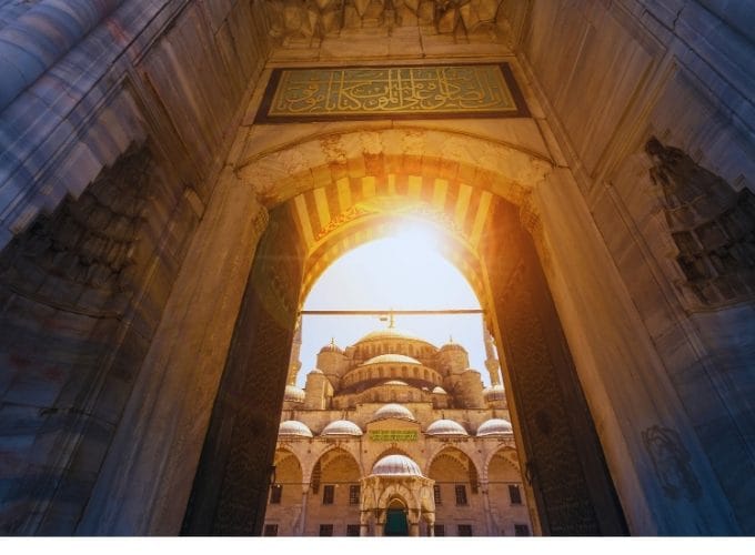 Exterior view of the Blue Mosque in Istanbul, showcasing its iconic domes and minarets.